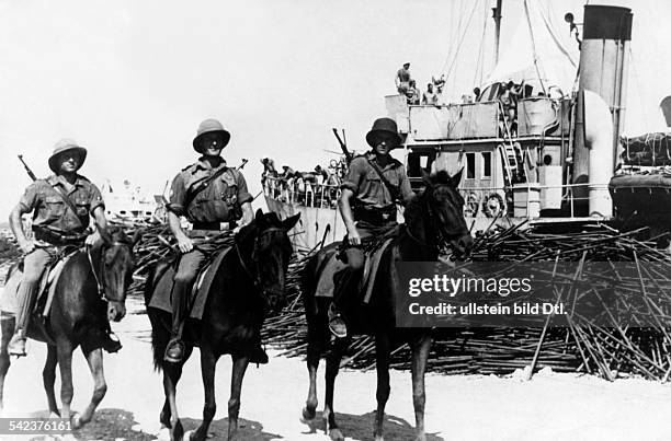 Mounted German patrol service is guarding the port of Cephalonia after it was captured by German forces