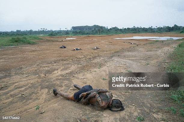 Supporters of Liberian president Samuel Doe, executed by the National Patriotic Front of Liberia , lie rotting in a clearing in Paynesville....