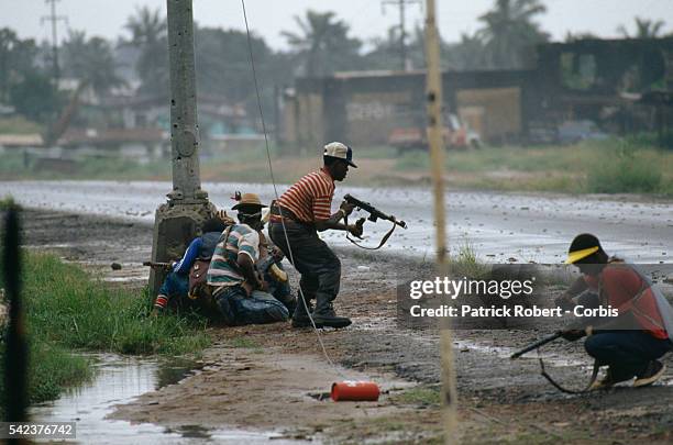 Rebels with the National Patriotic Front of Liberia engage the 72nd Battalion, government soldiers faithful to Liberian president Samuel Doe....