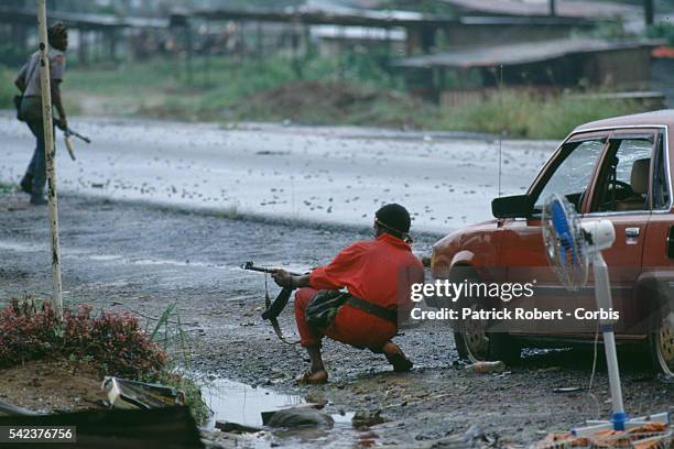 Rebels with the National Patriotic Front of Liberia engage the 72nd Battalion, government soldiers faithful to Liberian president Samuel Doe....