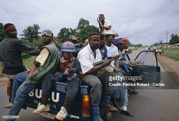 Truckload of rebels from the National Patriotic Front of Liberia drive through Congo Town on their way to the capital. Responding to years of...