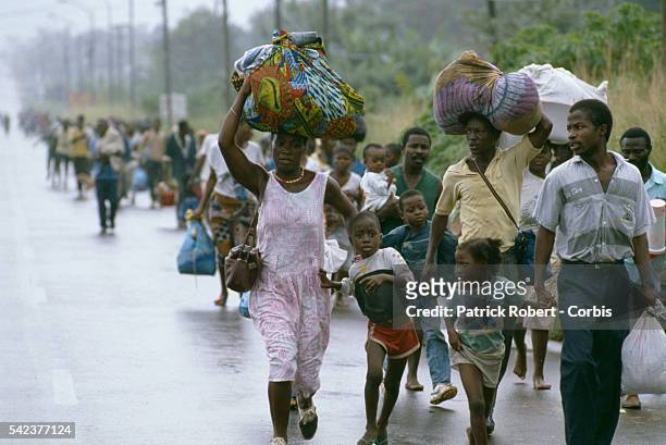 Crowd of refugees flee their homes as forces from the National Patriotic Front of Liberia head to the Liberian capital, Monrovia. Responding to years...