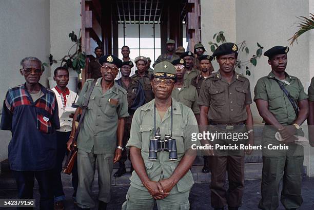 Brigadier General David Nimley, commander of President Samuel Doe's Armed Forces of Liberia , stands among his troops in Monrovia. Responding to...