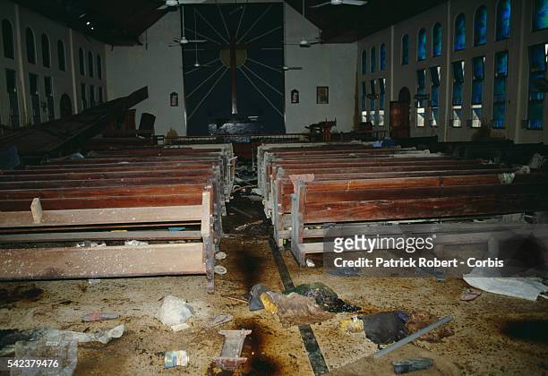 Bloodied clothing litters the floor of St. Peter's Lutheran Church in Monrovia, the site of a brutal massacre. On July 29 troops from President...