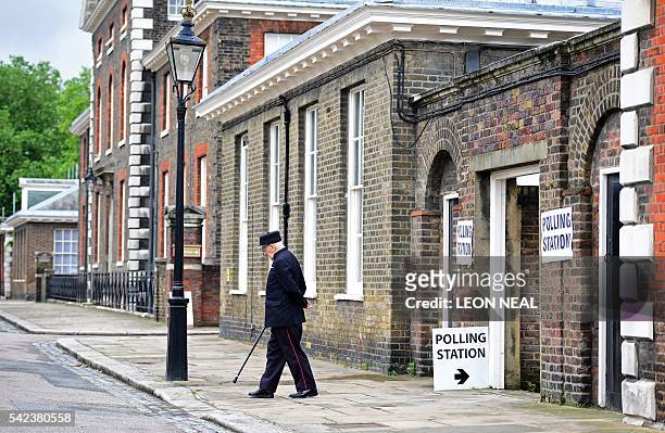 Chelsea pensioner leaves a polling station after casting his ballot paper at the Royal Hospital in Chelsea, west London on June 23 as Britain holds a...