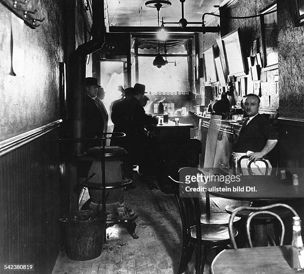 Interior of a speakeasy during Prohibition on the East Side of New York. Photographed 1932.