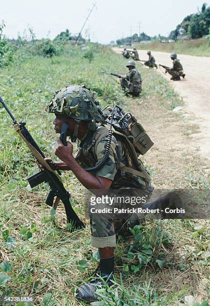 Nigerian soldiers from ECOMOG patrol the Caldwell front during the Liberian Civil War. In 1989, Charles Taylor, leader of the NPFL , launched a...