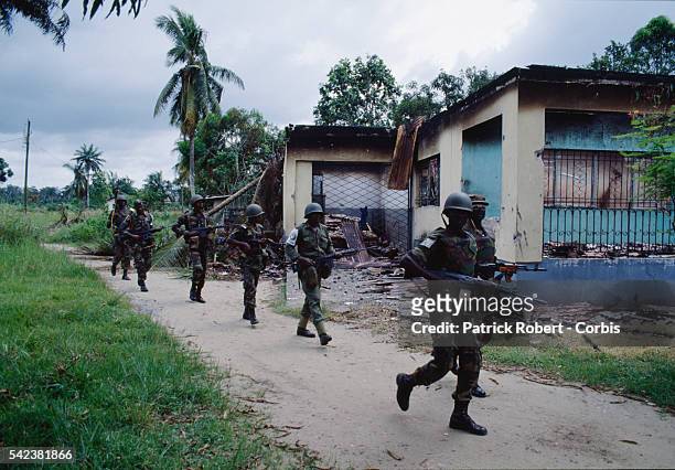 Nigerian soldiers from ECOMOG patrol the Caldwell front during the Liberian Civil War. In 1989, Charles Taylor, leader of the NPFL , launched a...