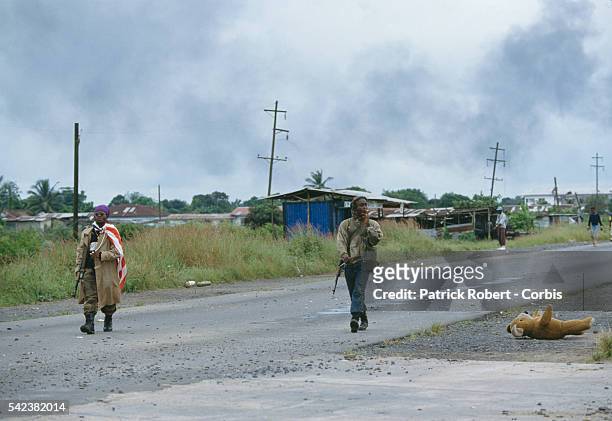 Forces under pressure from Ghanaian ECOMOG forces defend the Schieffelin front, 15 kilometers from Monrovia, during the Liberian Civil War. The Armed...