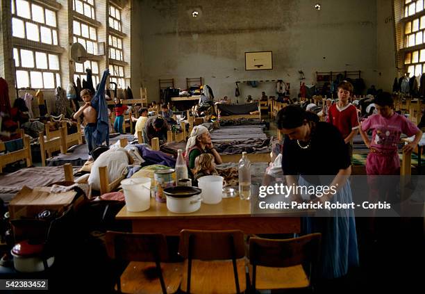 Muslim refugees from Banja Luka shelter in a sports room in Travnik during the Yugoslavian Civil War. Conflict among the Croats, Serbs, and Muslims...
