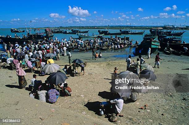 Cox's Bazar is known as the world's longest natural sea beach. Fishermen back from fishing.