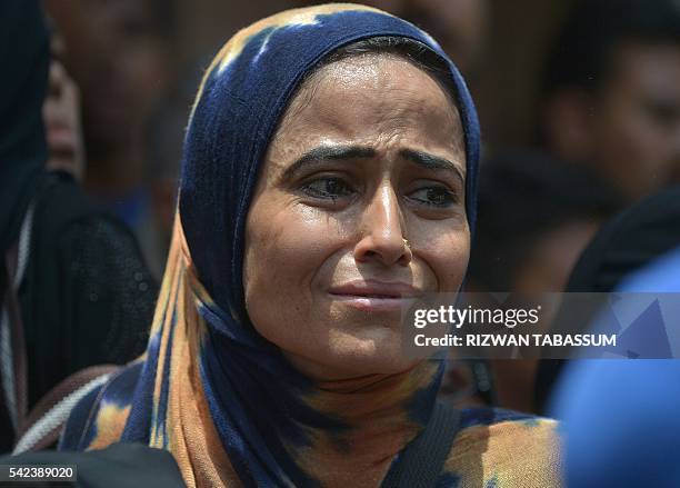 Pakistani mourners gather near the funeral procession for Sufi musician Amjad Sabri in Karachi on June 23, 2016. Thousands of Pakistanis on June 23...