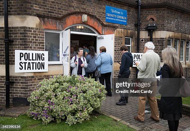 Voters queue to enter a polling station at Trinity Church in Golders Green on June 23, 2016 in London, England. The United Kingdom has gone to the...