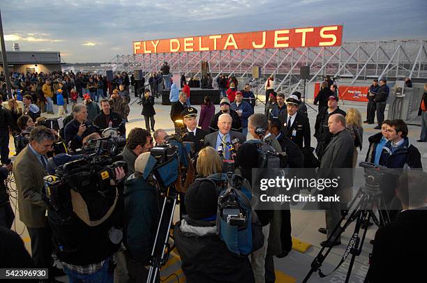 Delta CEO Gerald Grinstein addresses members of the media after a sign lighting ceremony in Atlanta.