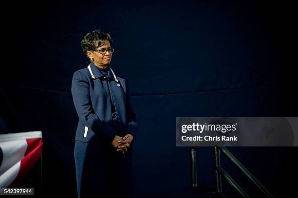 Atlanta, Georgia- Presidential hopeful Herman Cain's wife, Gloria, listens as Cain bows out in front of his Georgia Headquarters in Atlanta, GA on...