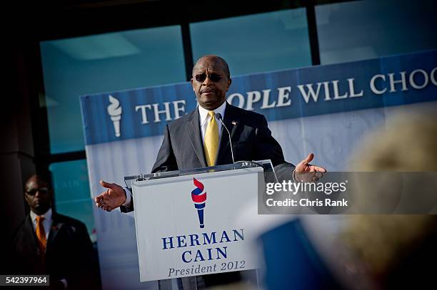 Atlanta, Georgia- Presidential hopeful Herman Cain bows out in front of his Georgia Headquarters in Atlanta, GA on Saturday, December 3,2011....