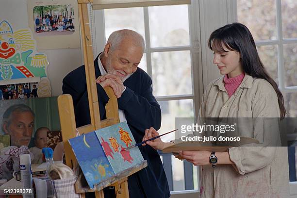 French actor Michel Serrault with his granddaughter Gwendoline.
