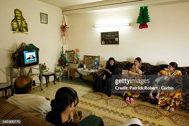 Everywhere in Iraq, television sets are tuned into the Arab-language station Al Jazeera or other Arabic channels, like in the Om Abbasse's...