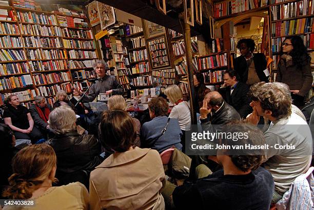 Poet Alan Jenkins reads one of his poems during the Monday evening poetry reading workshop at the bookshop. The Shakespeare and Company bookstore,...