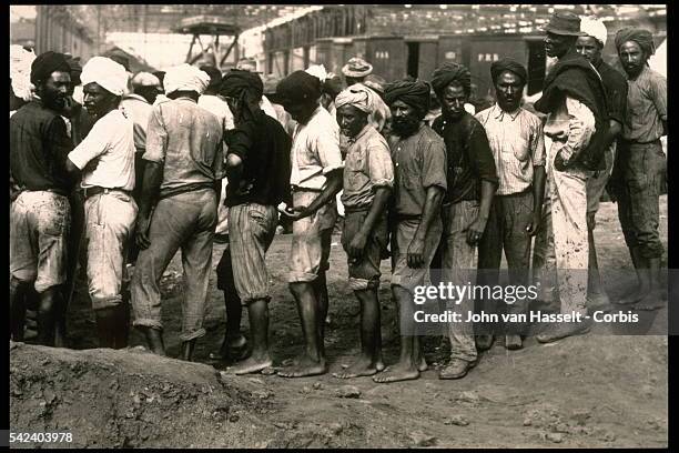 The Culebra Cut, formerly called Gaillard Cut, is an artificial valley that cuts through the continental divide in Panama. Workers waiting for their...