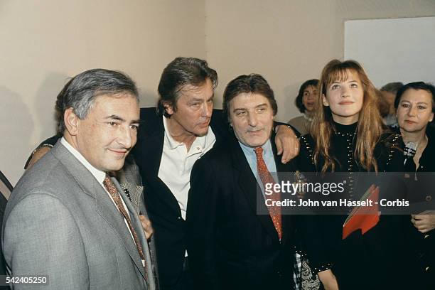 French Minister for Industry Dominique Strauss-Kahn, actor Alain Delon, fashion designer and actress Sophie Marceau attend the 1993 Spring Summer...