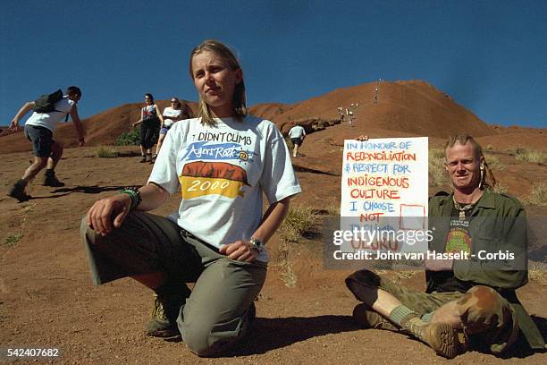 Rusty and his partner, members of the Earthdream ecological movement, demonstrate against tourists climbing the sacred Aboriginal monolith.