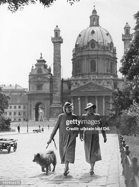 Austria, Vienna, two women having a walk with a dog, in the background the Karlskirche at the Kalrsplatz- Photographer: Lothar Ruebelt- 1937Vintage...