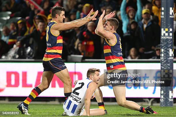 Taylor Walker and Josh Jenkins of the Crows celebrate a goal during the 2016 AFL Round 14 match between the Adelaide Crows and the North Melbourne...