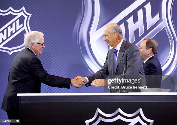 New Las Vegas NHL franchise owner Bill Foley and owner Jeremy Jacobs of the Boston Bruins shake hands during the Board Of Governors Press Conference...