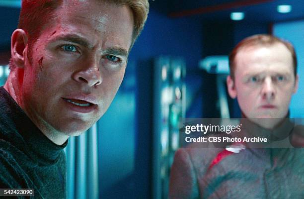 Chris Pine as Captain James T. Kirk with Simon Pegg as Lieutenant Commander Montgomery "Scotty" Scott in the background in the 2013 movie, "Star...