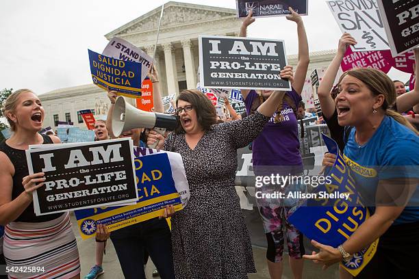 Kristan Hawkins, president of Students for Life, center, and other pro-life protesters clash with pro-choice protesters in front of the U.S. Supreme...