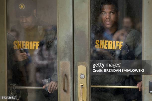 Baltimore County Sheriffs officers stand guard after Baltimore Officer Caesar Goodson Jr. Was acquitted of all charges in his murder trial for the...