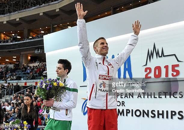 March 2015; Ireland's Mark English looks on as winner Marcin Lewandowski, Poland, celebrates after their Men's 800m Final event, where he finished in...
