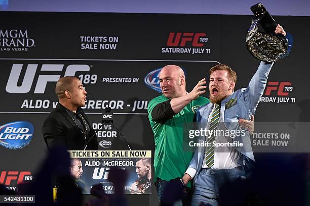 March 2015; UFC featherweight Conor McGregor, right, grabs the title belt from UFC featherweight Champion Jose Aldo during a fan event. The...