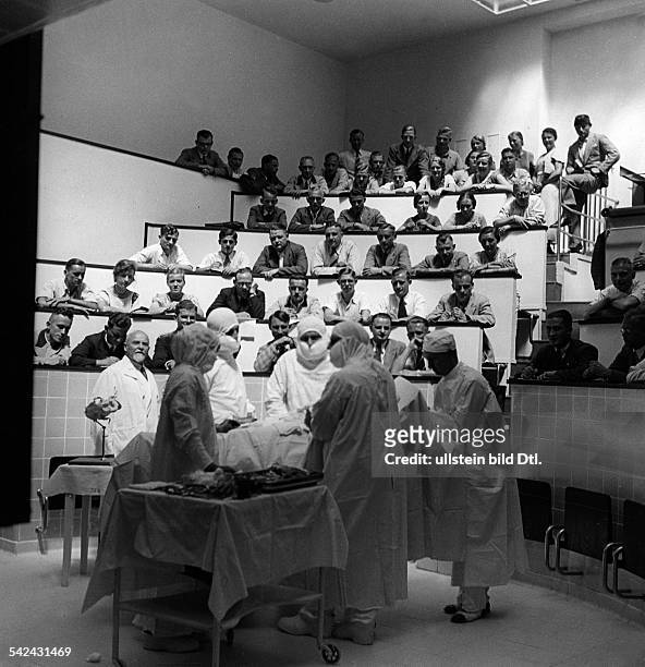 Students watching an operation in the operating room of a gynaecological hospital in Marburg, Germany - 1930ies