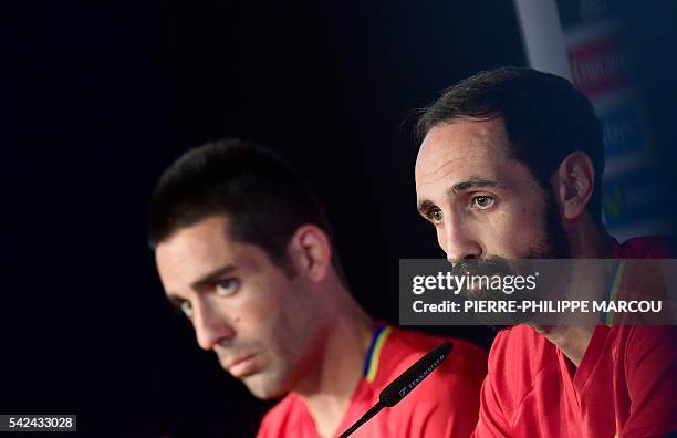 Spain's midfielder Bruno and Spain's defender Juanfran listen on during a press conference ahead of a training session at Saint Martin de Re's...