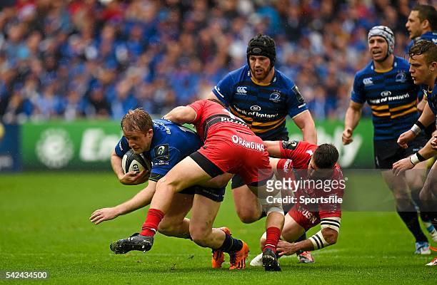 April 2015; Luke Fitzgerald, Leinster, is tackled by Frederic Michalak, and Sebastien Tillous-Borde, Toulon. European Rugby Champions Cup Semi-Final,...