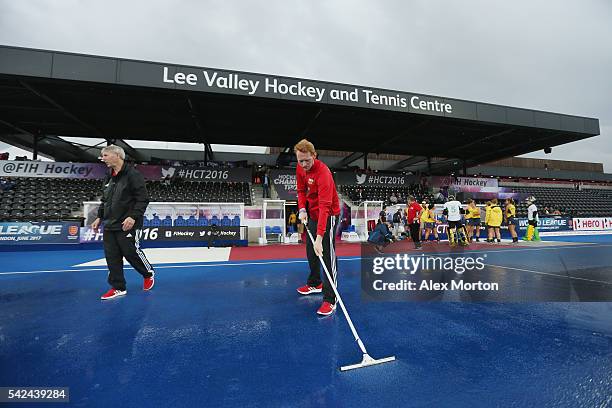 The pitch is cleared of water prior to the FIH Women's Hockey Champions Trophy match between Australia and Netherlands at Queen Elizabeth Olympic...