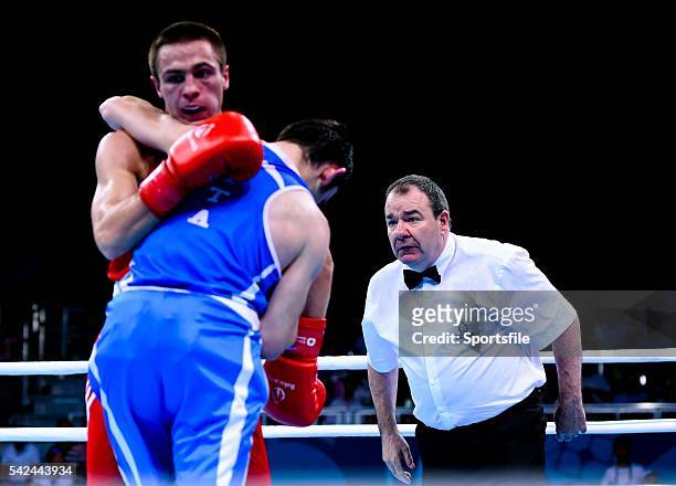 June 2015; Referee Micky Gallagher, Ireland, watches Riccardo D'Andrea, Italy, and Iurii Shestak, Ukriane, during their Men's Boxing Bantam 56kg...