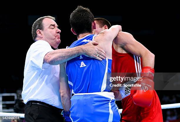 June 2015; Referee Micky Gallagher, Ireland, seperates Riccardo D'Andrea, Italy, and Iurii Shestak, Ukriane, during their Men's Boxing Bantam 56kg...