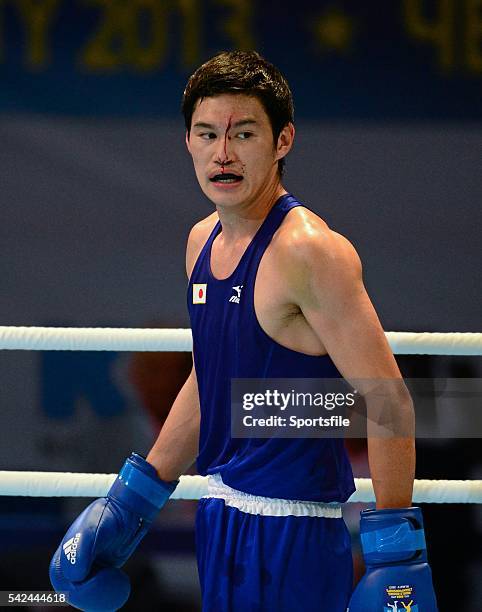 October 2013; Yasuhiro Suzuki, Japan, after receiving an injury during his 69Kg preliminary bout with Souleymane Cissokho, France. AIBA World Boxing...