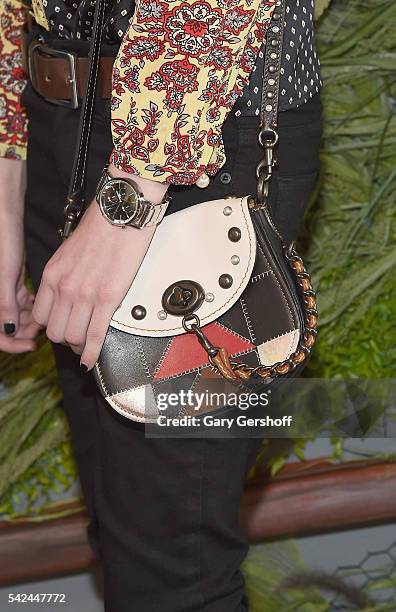 Model Ruth Bell, bag detail, attends the '2016 Coach and Friends of The Highline Summer Party' at The Highline on June 22, 2016 in New York City.