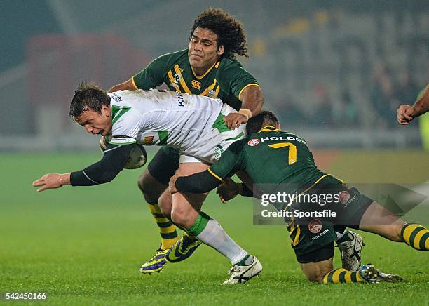 November 2013; Stuart Littler, Ireland, is tackled by Sam Thaiday,top, and Cooper Cronk, Australia. Rugby League World Cup, Group A, Ireland v...