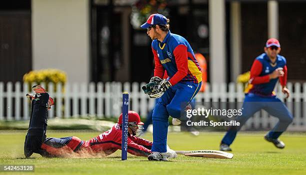 July 2015; Jersey's Jonty Jenner slides in after scoring two runs, as the ball is mis-fielded by Namibia's wicket keeper J.P Kotze. ICC World...