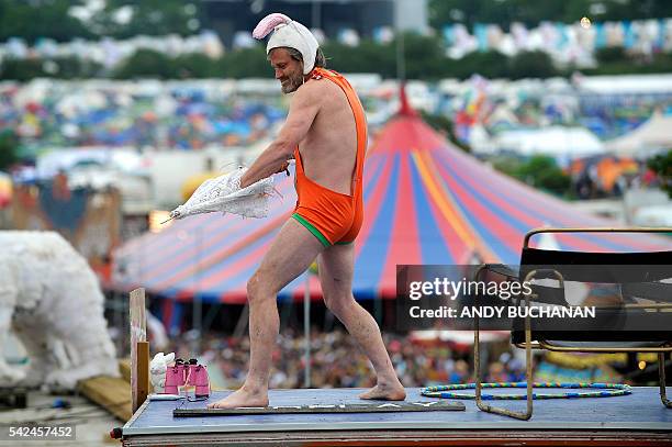 Man wearing a mankini performs on the second day of the Glastonbury Festival of Music and Performing Arts on Worthy Farm near the village of Pilton...