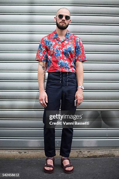 Jean Sebastien Roques poses wearin a Louis Vuitton shirt, Levis pants and Valentino shoes after the Andrea Crews show at the Maison des Metallos...