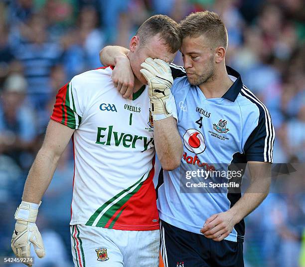 September 2013; Jonny Cooper, right, Dublin, consoles Mayo goalkeeper Robert Hennelly at the end of the game. Both players attended Dublin City...