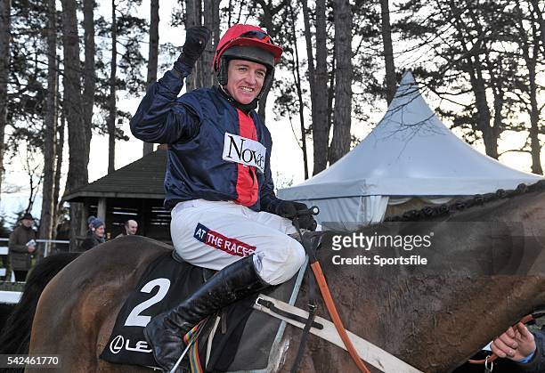 December 2013; Jockey Barry Geraghty celebrates as he makes his way into the winners enclosure after his mount, Bobs Worth, won The Lexus...