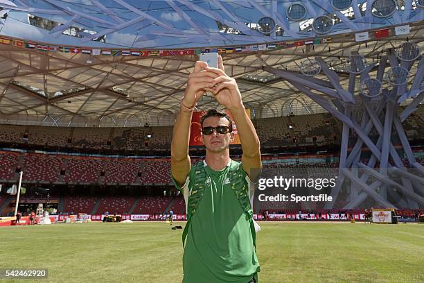 August 2015; Ireland's Timmy Crowe, a member of the 4x400m relay team takes some pictures ahead of the IAAF World Track & Field Championships at the...