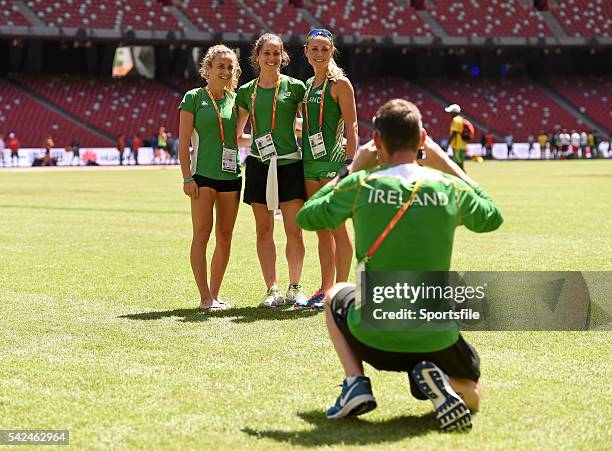 August 2015; Irish 3000m steeplechase athletes, from left, Michelle Finn, Sara Treacy and Kerry O'Flaherty have their picture taken by coach Paul...